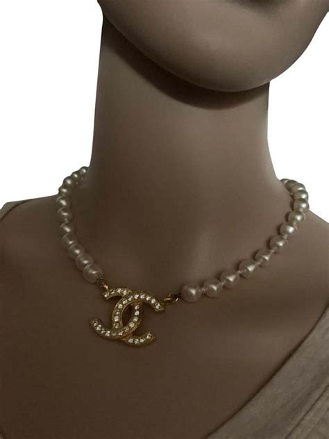 pearl necklace with chanel logo|chanel symbol necklace.